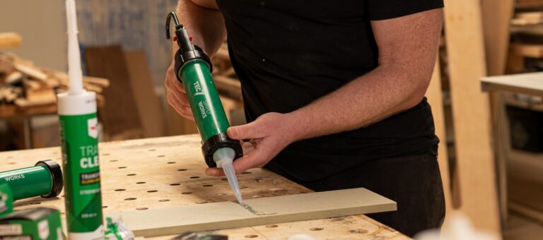 Man using the Tec7 Eco System gun to dispense tec7 adhesive